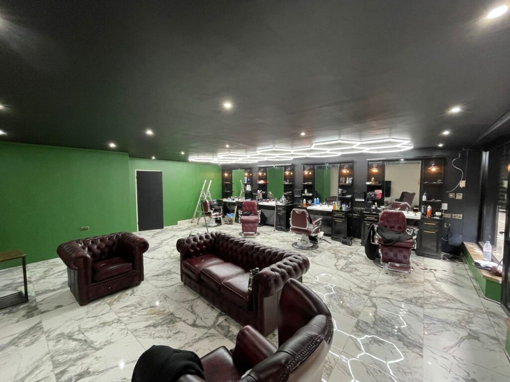 Painters and Decorators in Manchester 4 Prestige Painting Solutions team working on commercial property exterior